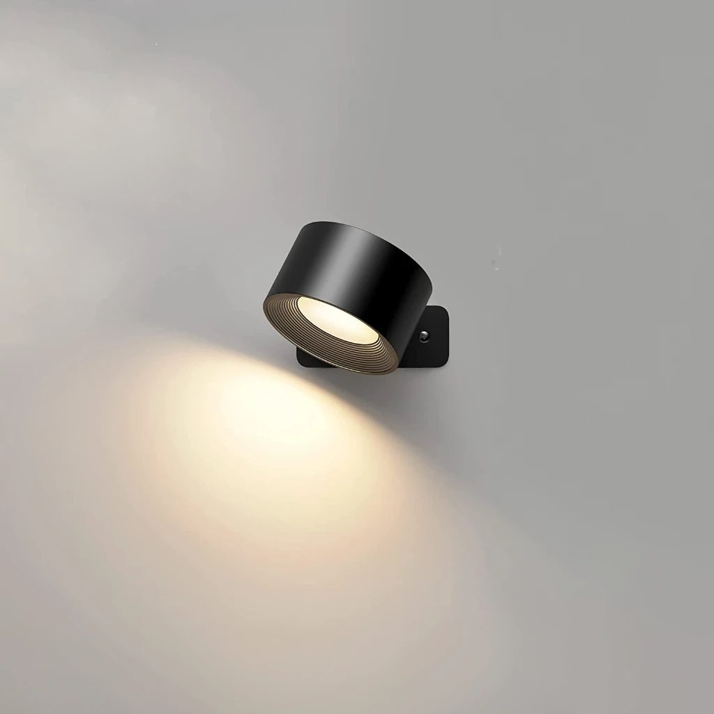 Almod rechargeable wall sconce casting warm light on a grey wall
